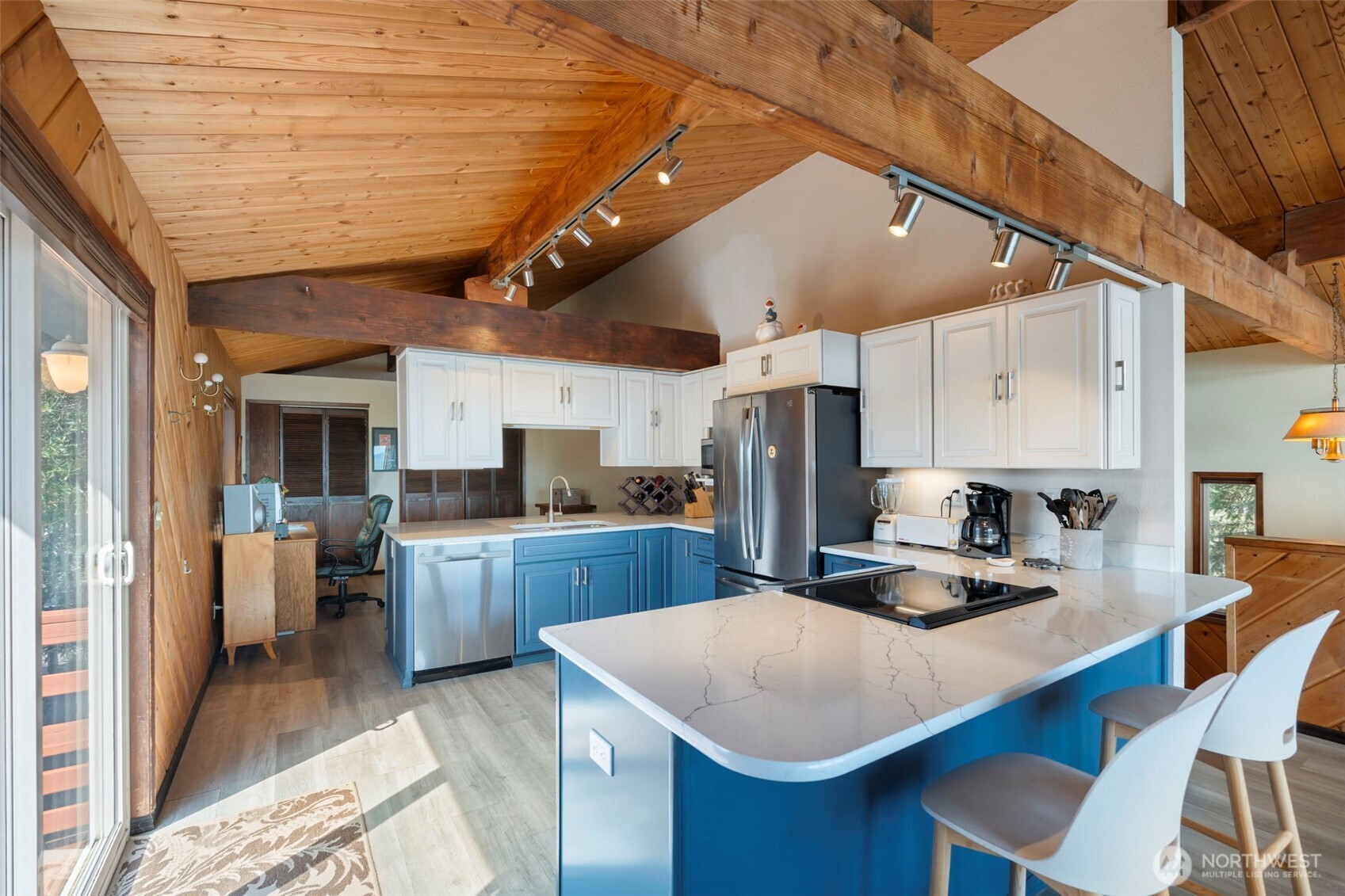326 Harbor View Loop Southeast Ocean Shores, WA 98569 - Photo 4 of 38 a kitchen with a sink a stove and chairs