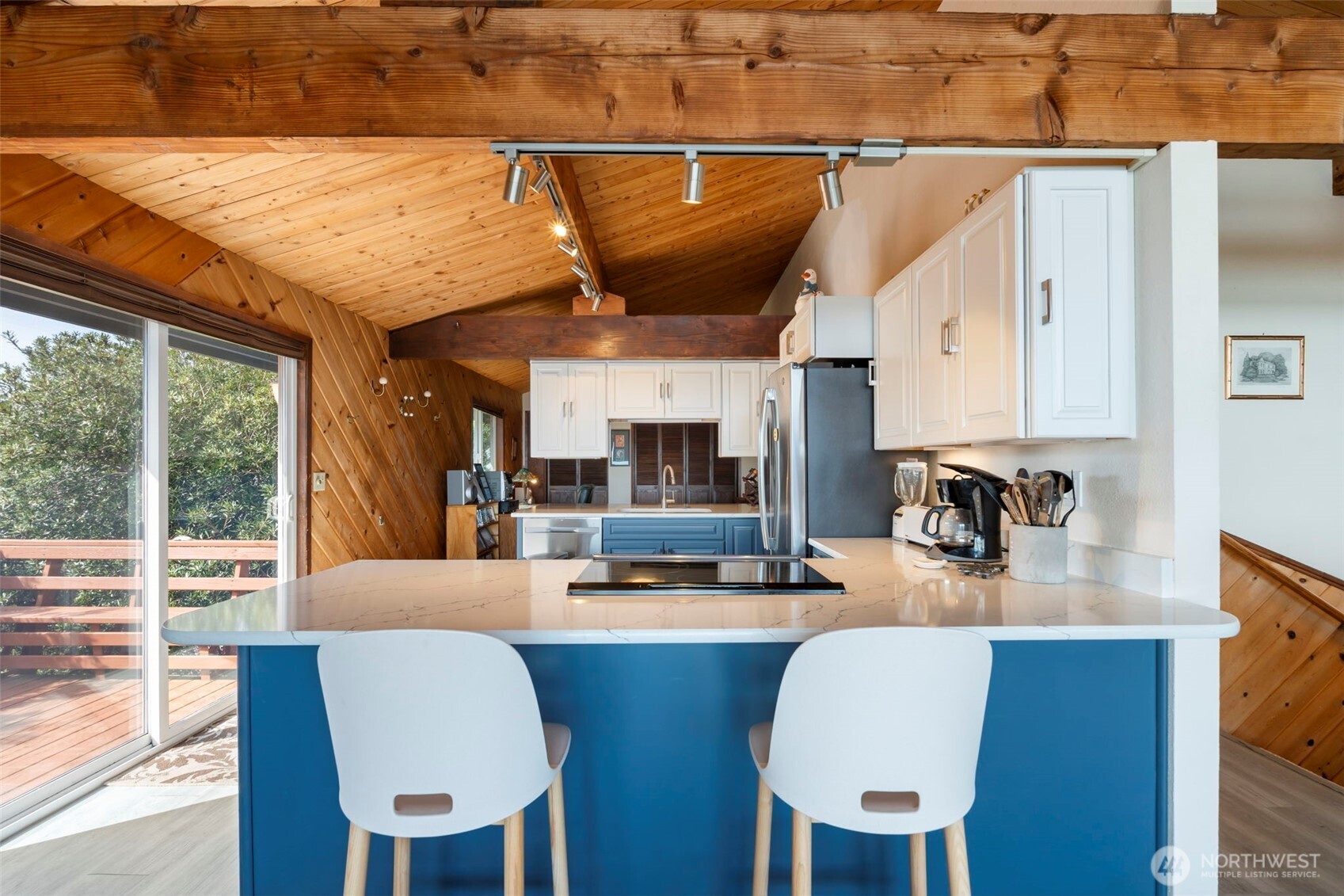 326 Harbor View Loop Southeast Ocean Shores, WA 98569 - Photo 5 of 38 a dining room with furniture and a floor to ceiling window
