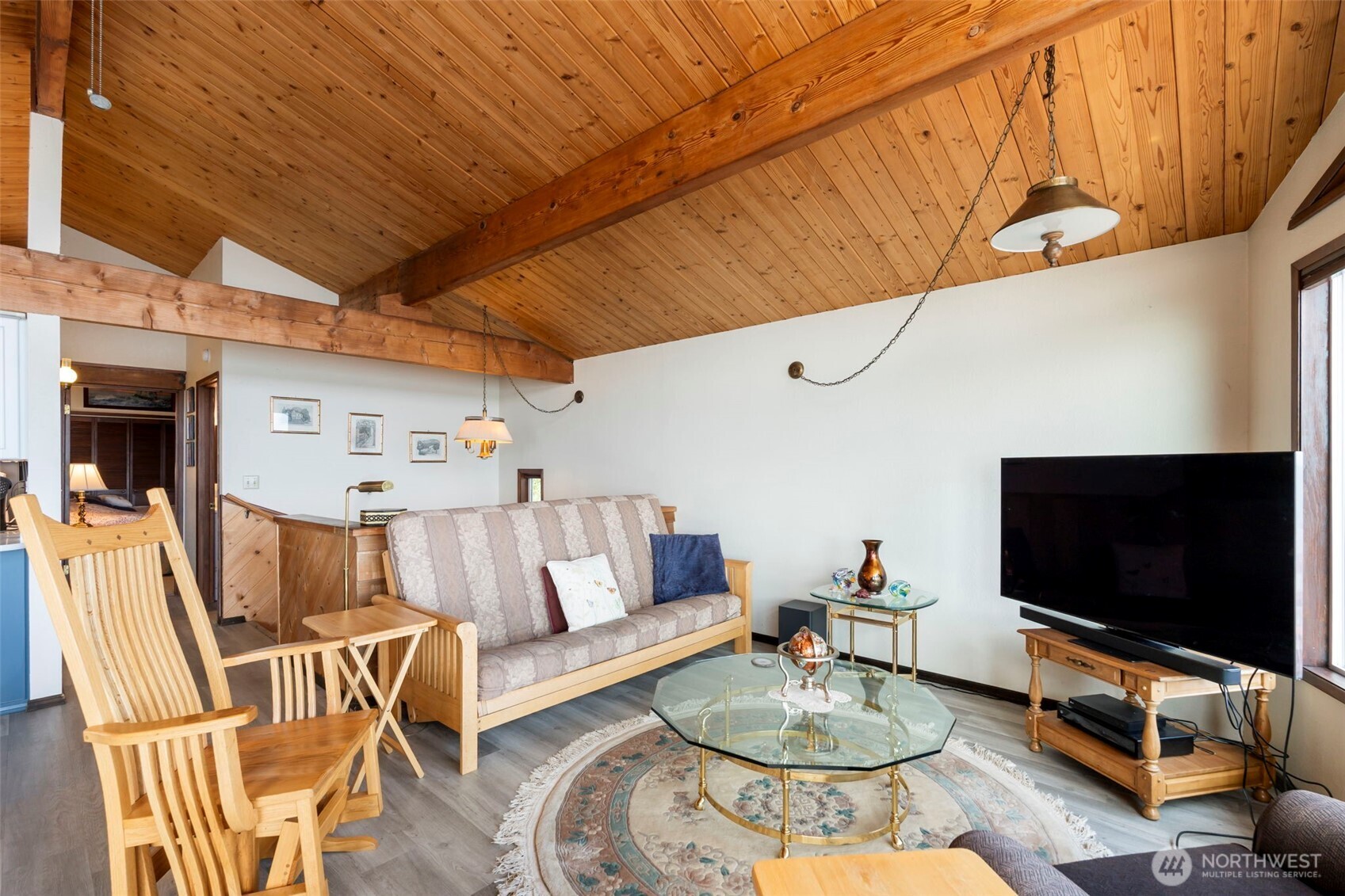 326 Harbor View Loop Southeast Ocean Shores, WA 98569 - Photo 6 of 38 a living room with furniture and a flat screen tv