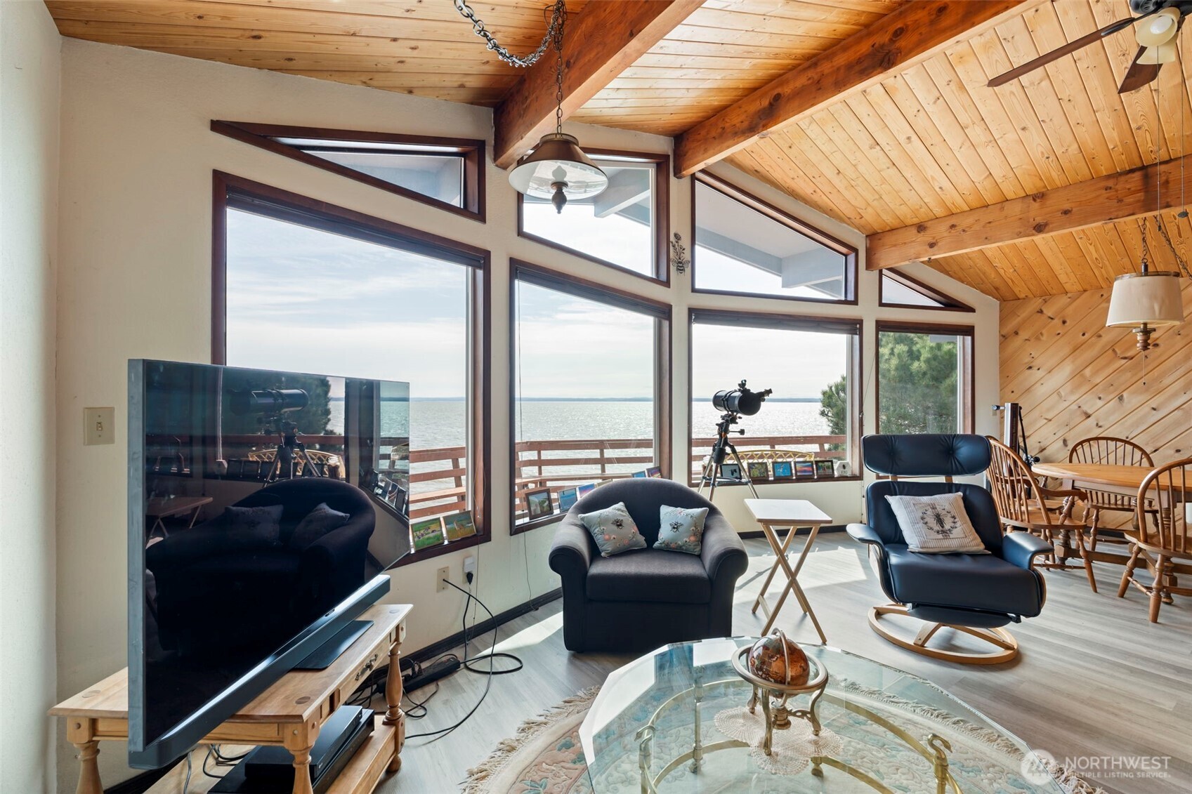 326 Harbor View Loop Southeast Ocean Shores, WA 98569 - Photo 8 of 38 a living room with furniture a rug water view and a large window