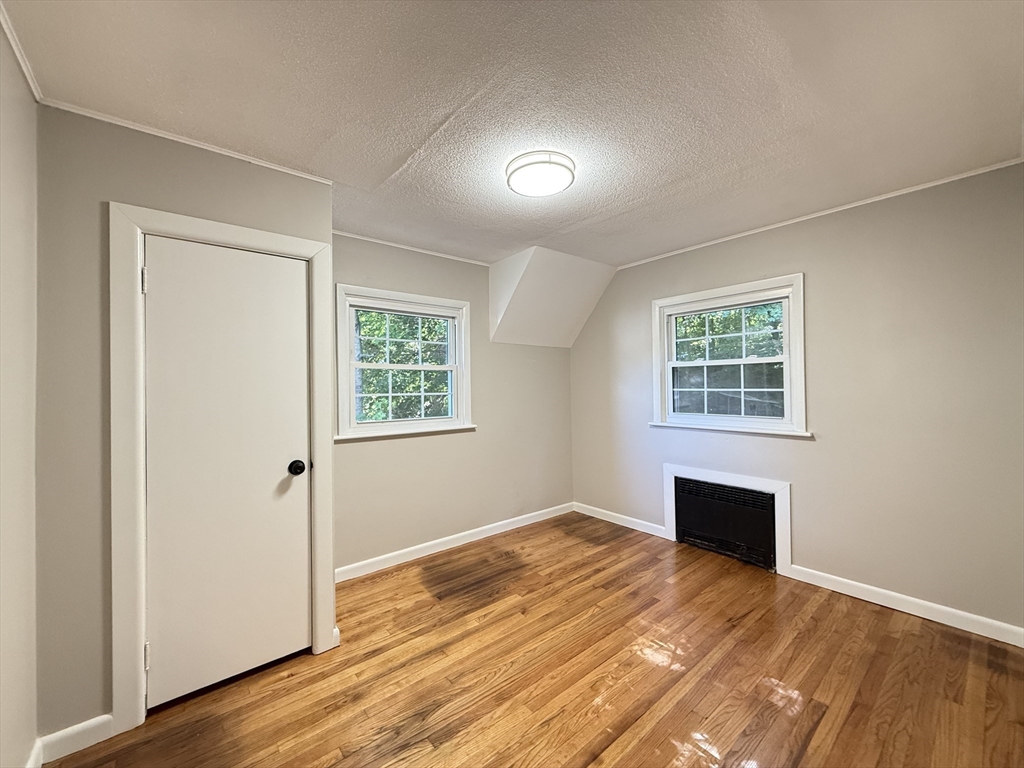 37 Bridge Street Monson, MA 01057 - Photo 14 of 35 an empty room with wooden floor and windows