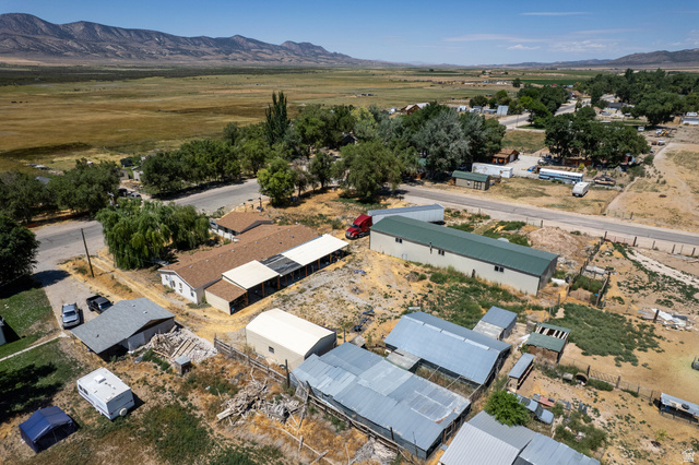 445 South Main Street Fayette, UT 84630 - Photo 8 of 45 Aerial view of property and surrounding area with mountains and nearby suburban area