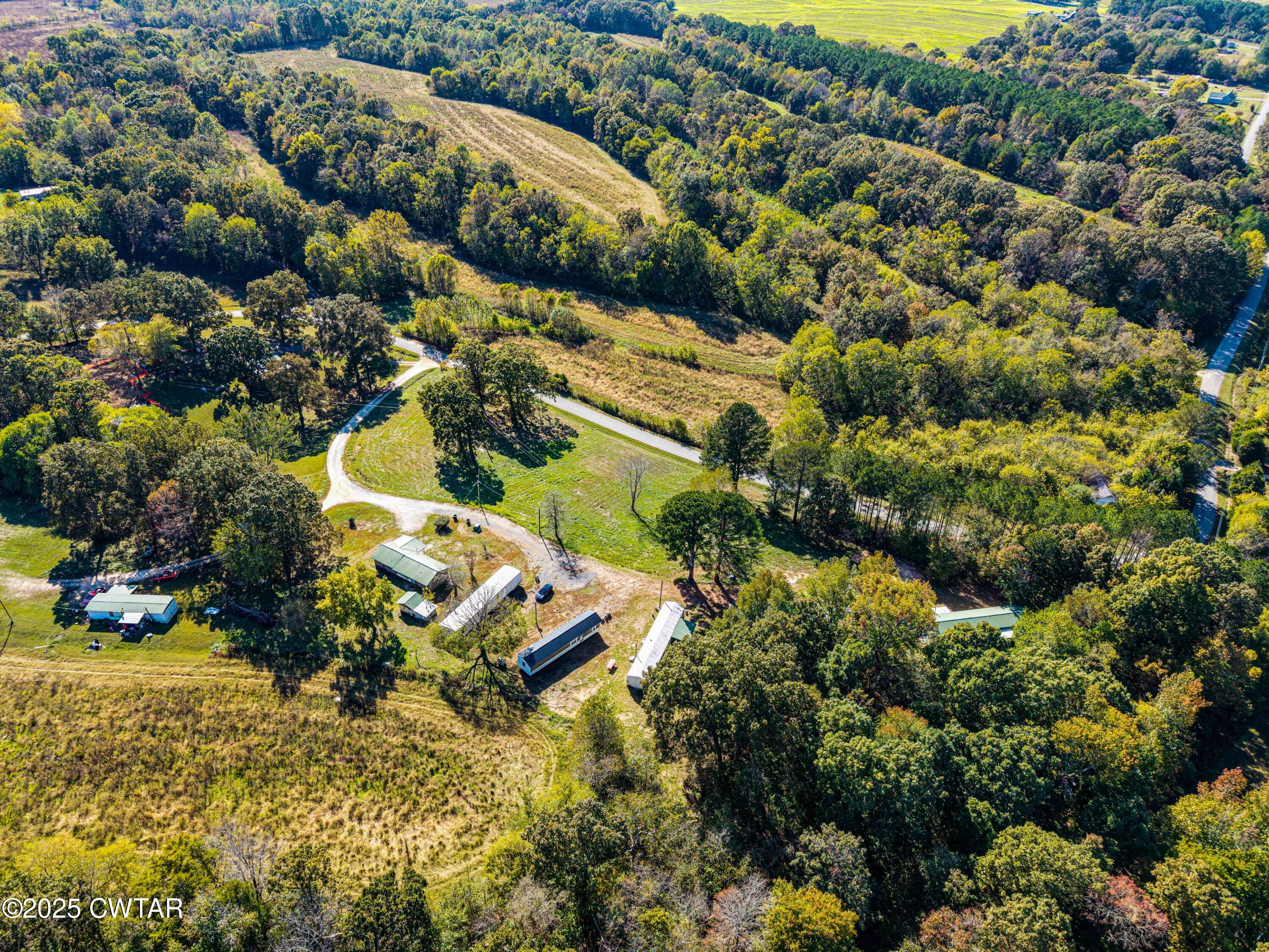 0 Charles Lane Cedar Grove, TN 38321 - Photo 3 of 16 an aerial view of residential house with outdoor space and swimming pool
