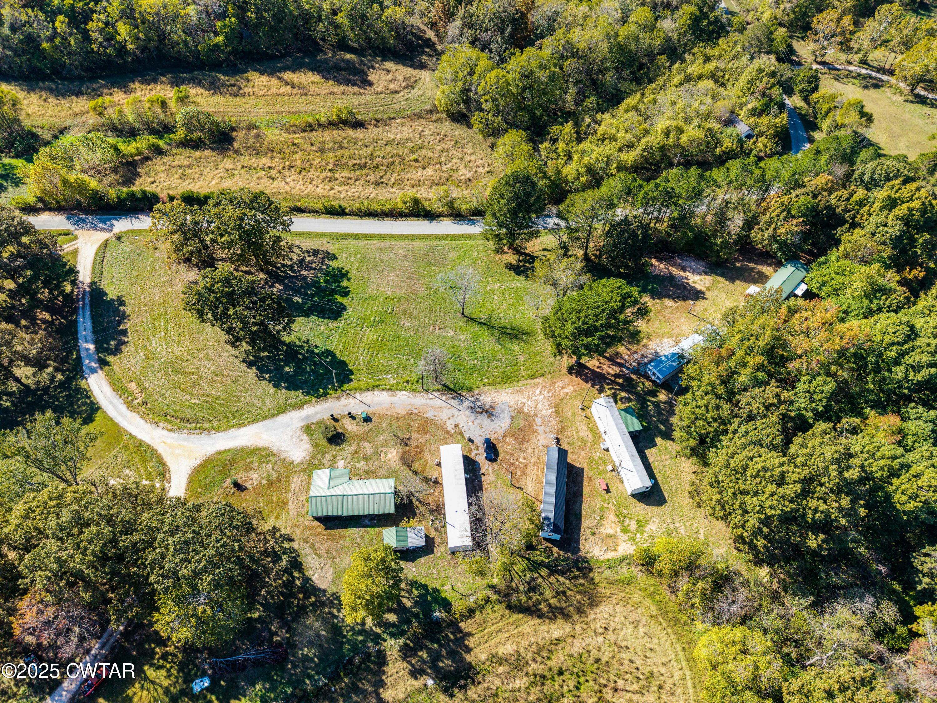 0 Charles Lane Cedar Grove, TN 38321 - Photo 4 of 16 a view of a lake with houses