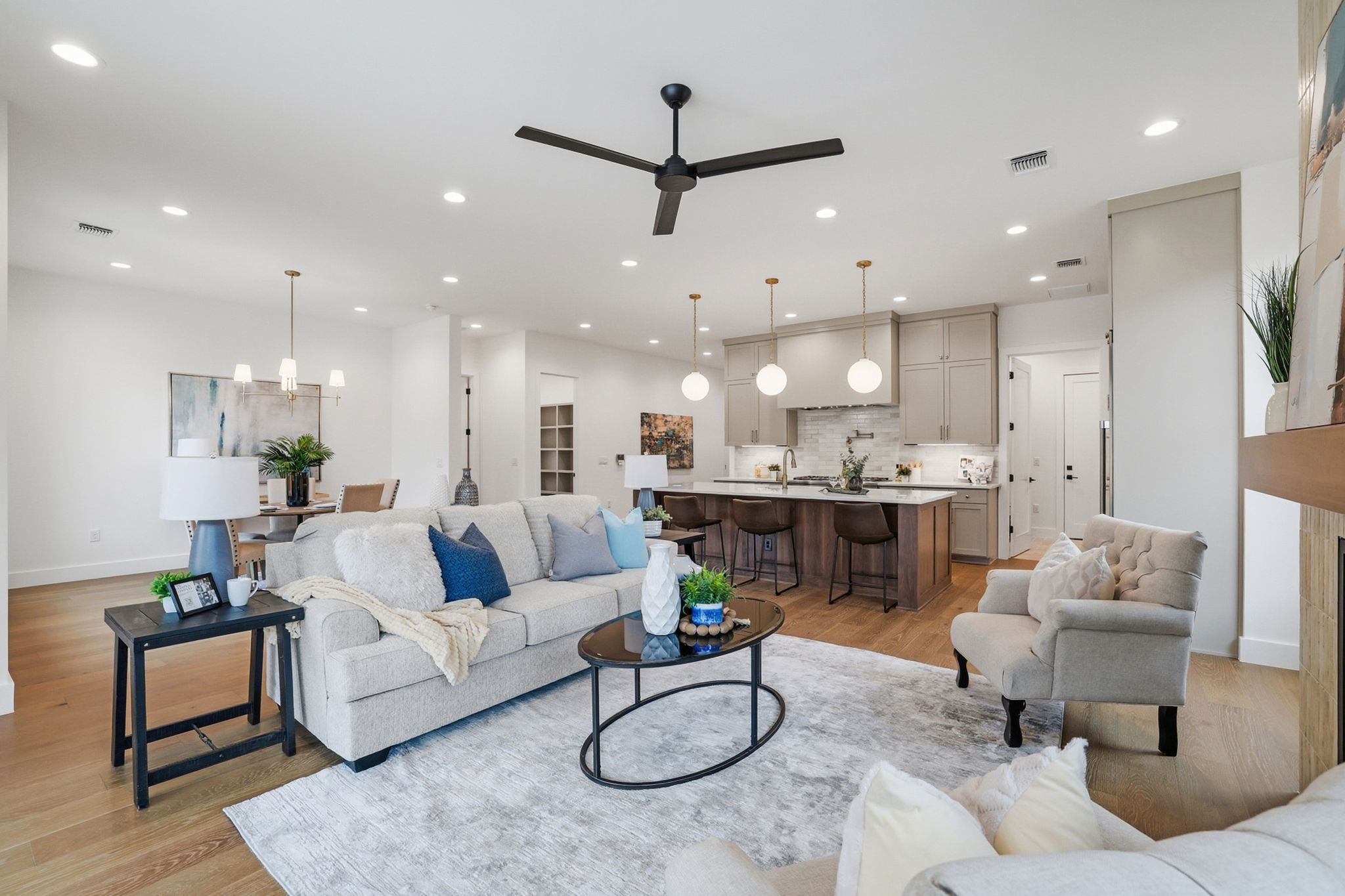 6611 Lexington Road Austin, TX 78757 - Photo 18 of 37 Open-concept living space featuring wood-finish flooring, recessed lighting, and a modern ceiling fan
