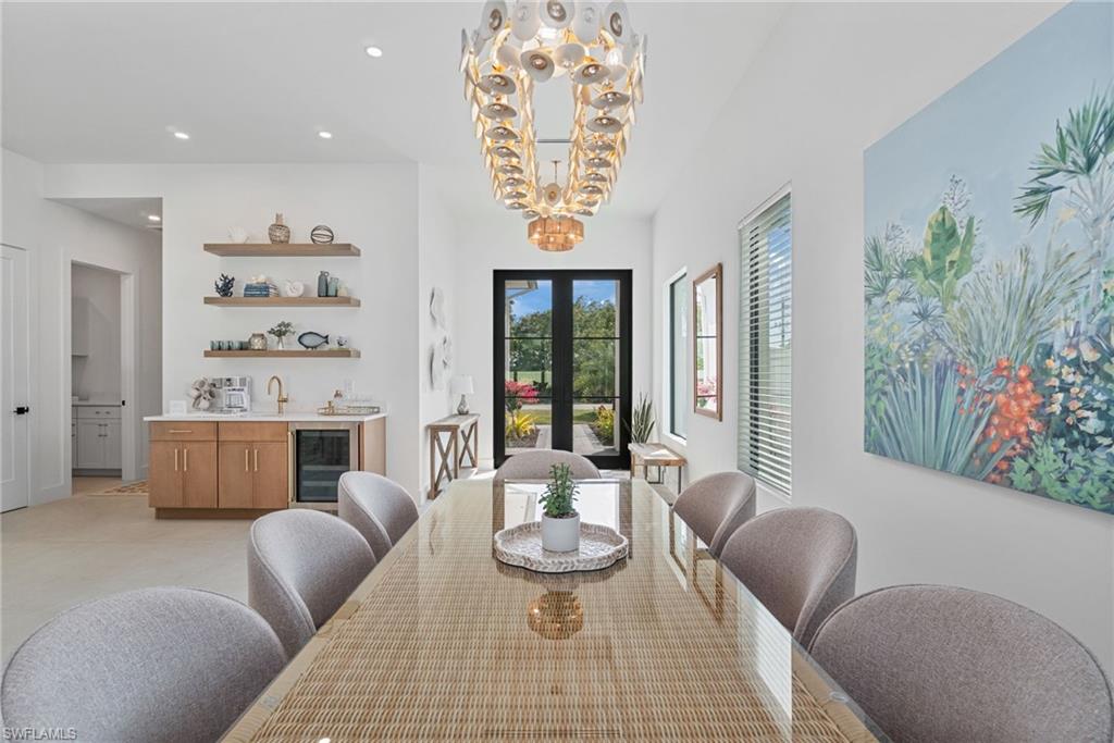 803 96th Avenue North Naples, FL 34108 - Photo 15 of 50 a living room with furniture and a potted plant