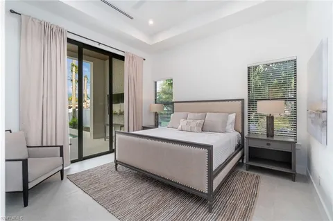 a room with a bed and a view of bedroom