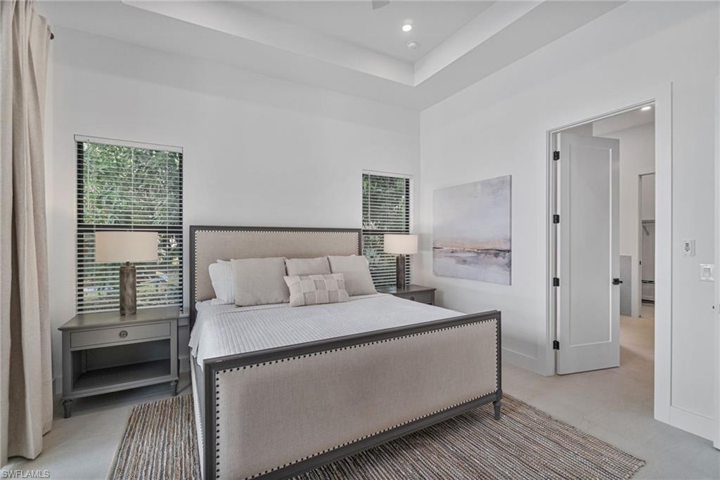 803 96th Avenue North Naples, FL 34108 - Photo 23 of 50 a room with a bed and a view of bedroom
