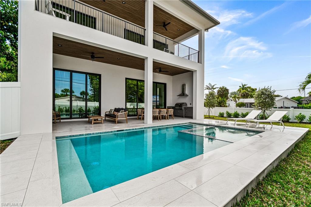 803 96th Avenue North Naples, FL 34108 - Photo 48 of 50 a view of a house with sitting area and furniture