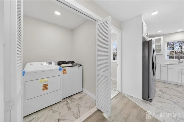 a utility room with dryer and washer