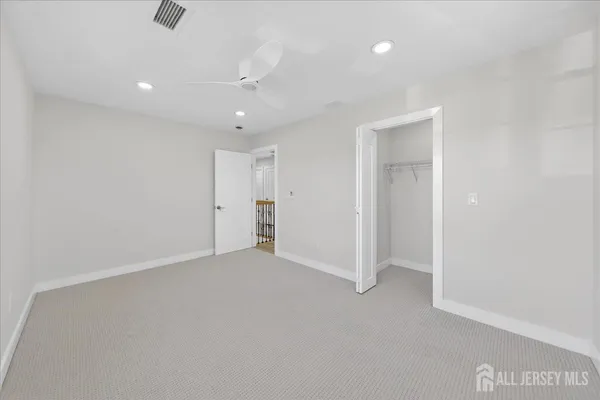 a view of hallway with wooden floor