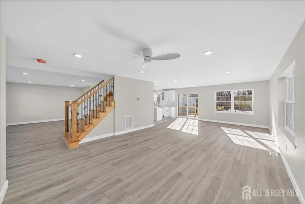a view of an entryway with wooden floor