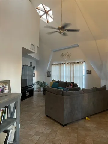 a living room with furniture and a window