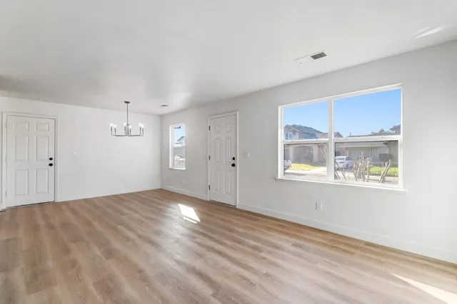a view of a pathway door with wooden fencing