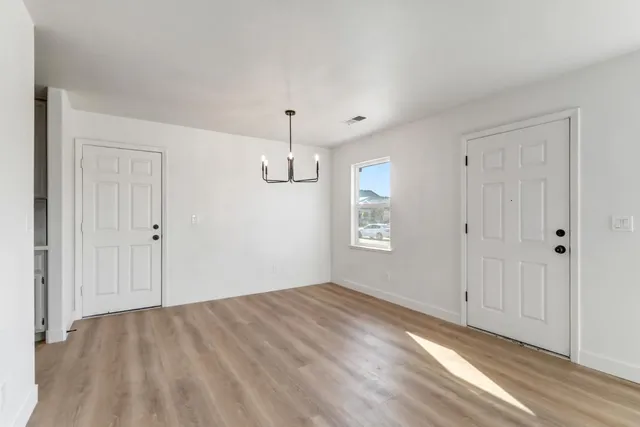 a front view of house with a garden