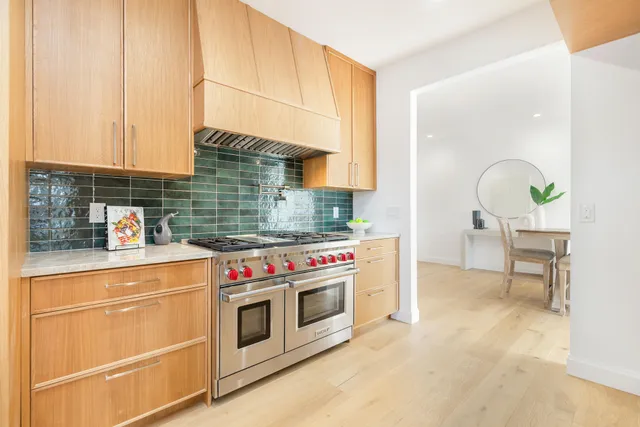 a kitchen with a stove and a cabinets