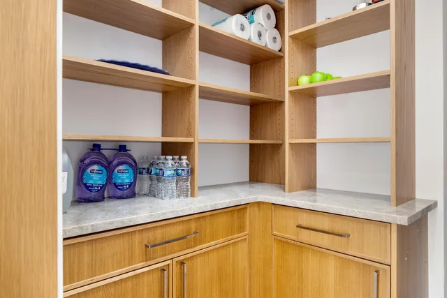 a kitchen with a refrigerator and a sink