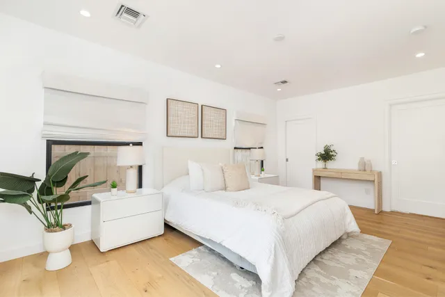 a bedroom with a bed and a couch