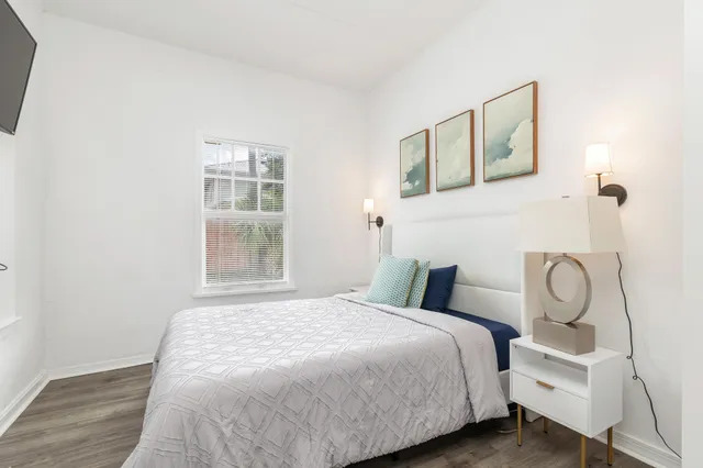 a bedroom with a bed and a window