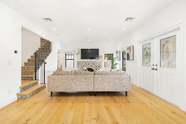 a living room with furniture and a flat screen tv