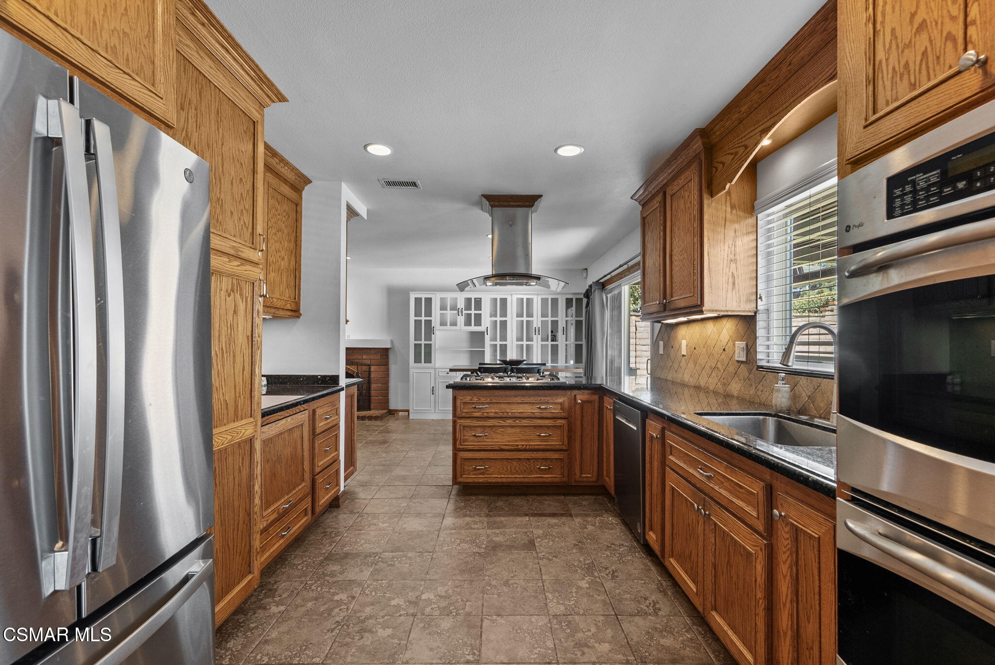 6435 Hazel Circle Simi Valley, CA 93063 - Photo 16 of 55 a kitchen with stainless steel appliances a refrigerator and stove