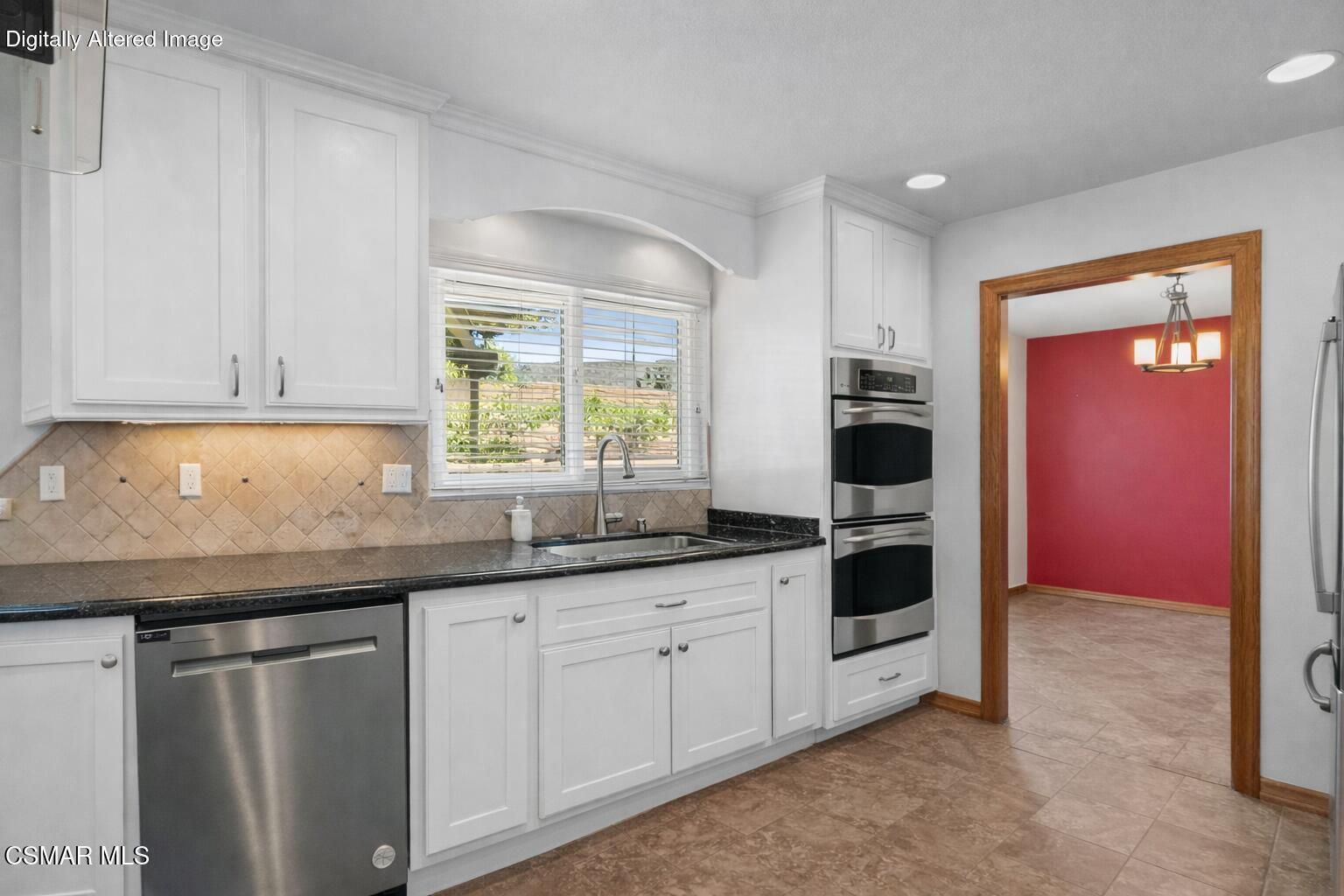 6435 Hazel Circle Simi Valley, CA 93063 - Photo 19 of 55 a kitchen with granite countertop white cabinets and white appliances