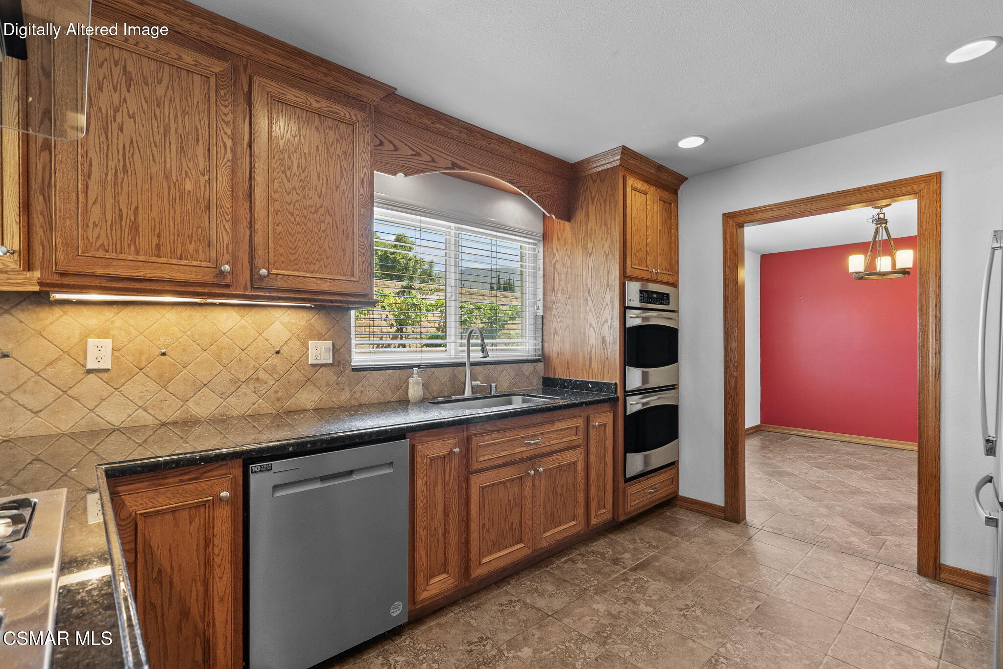 6435 Hazel Circle Simi Valley, CA 93063 - Photo 20 of 55 a kitchen with stainless steel appliances granite countertop a sink and cabinets with wooden floor