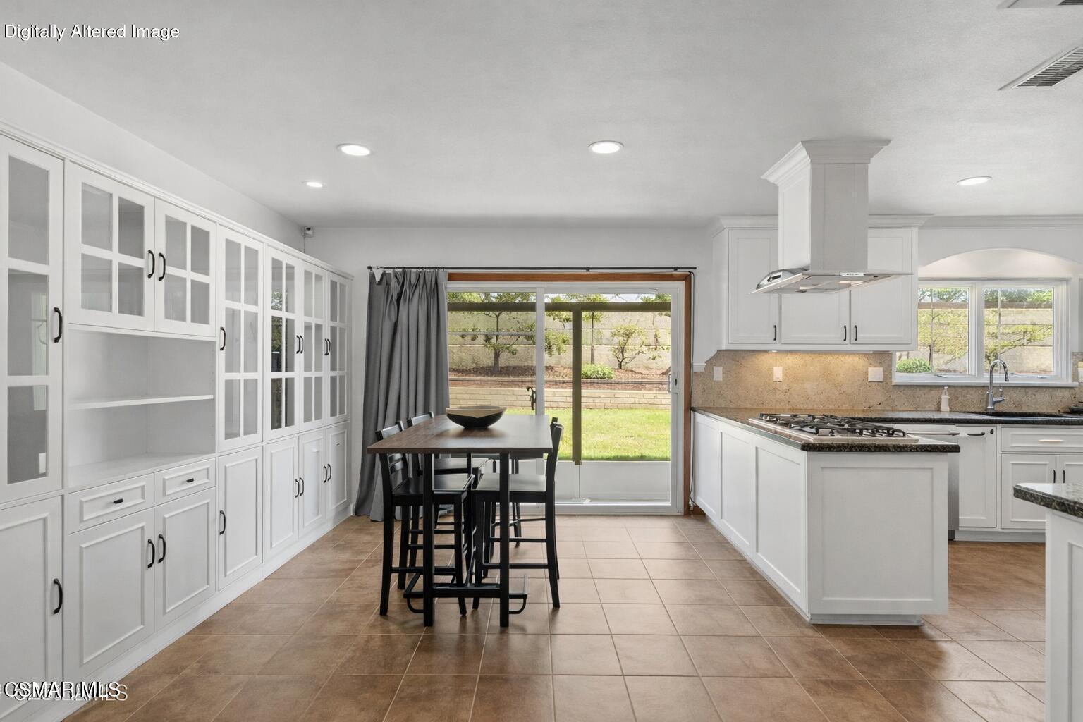 6435 Hazel Circle Simi Valley, CA 93063 - Photo 23 of 55 a kitchen with granite countertop a sink and white cabinets