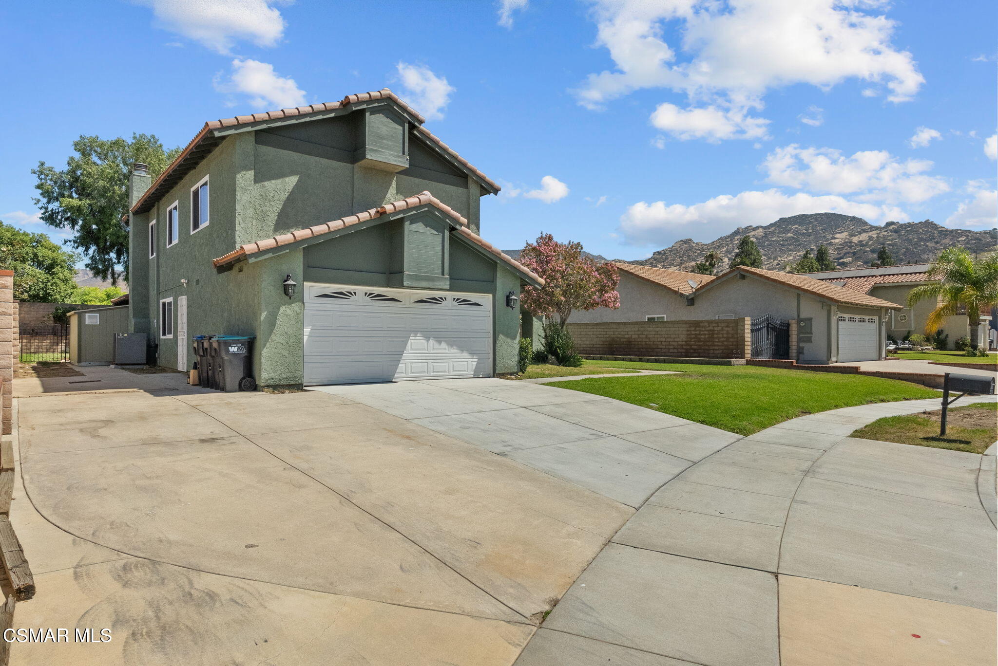 6435 Hazel Circle Simi Valley, CA 93063 - Photo 48 of 55 a front view of a house with a yard and garage