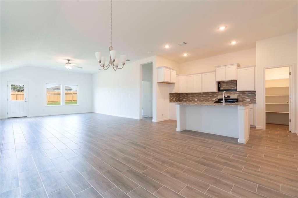 113 Caterpillar Lane Georgetown, TX 78628 - Photo 3 of 37 Dining Room and kitchen