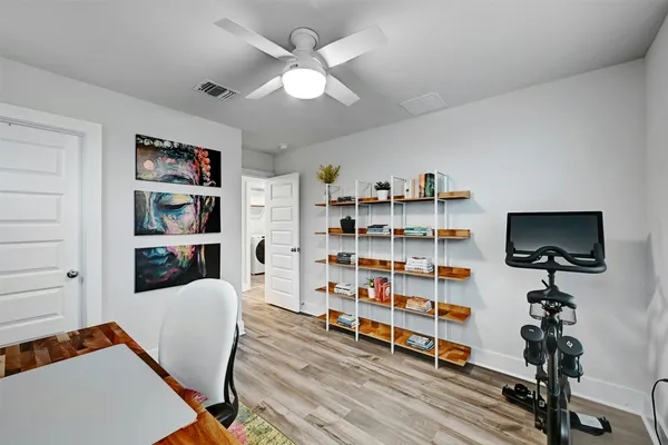 a view of a livingroom with furniture and staircase