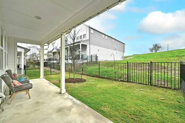 a view of a garden with an outdoor seating