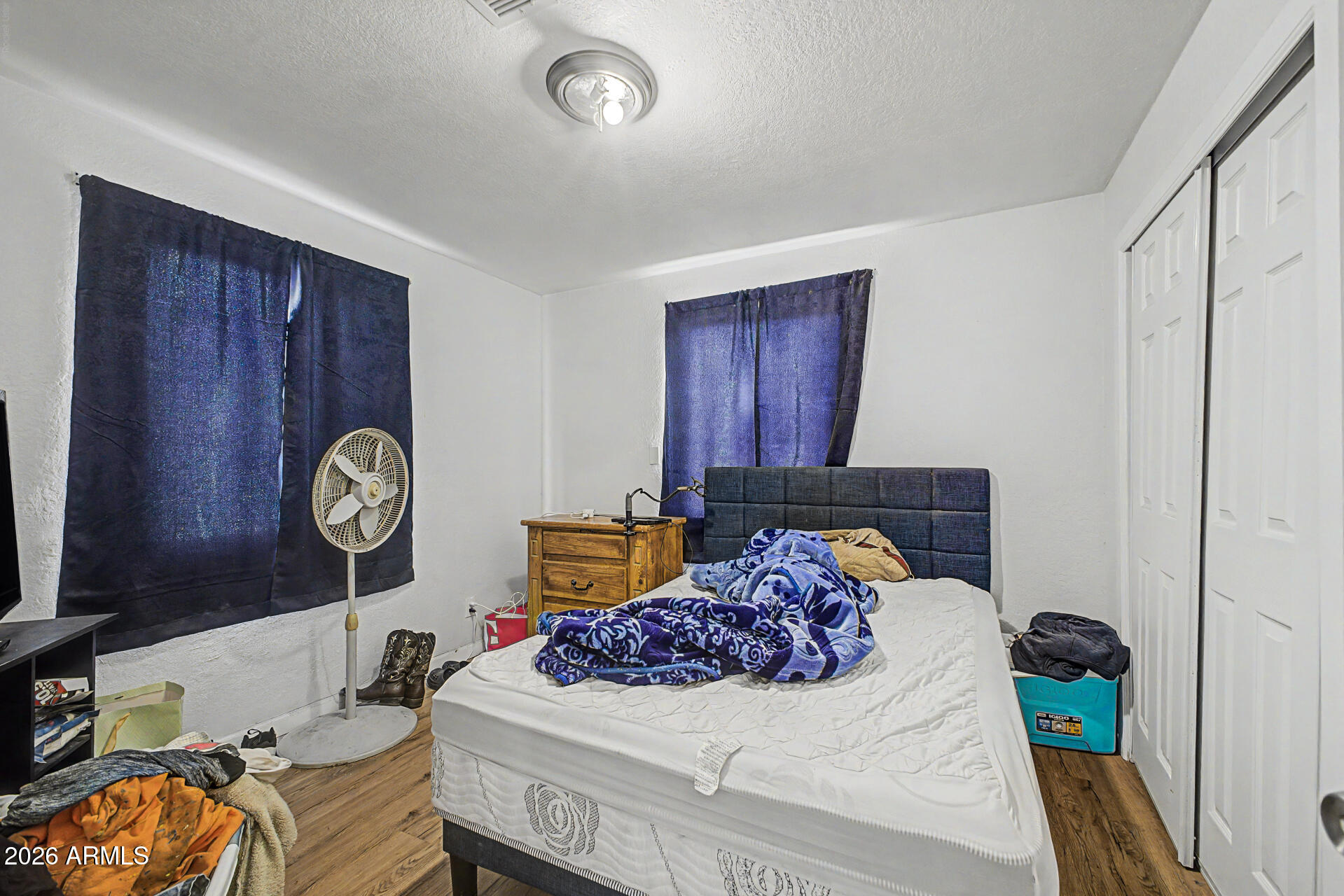 1030 North 28th Street Phoenix, AZ 85008 - Photo 16 of 24 a bedroom with a bed and a chandelier