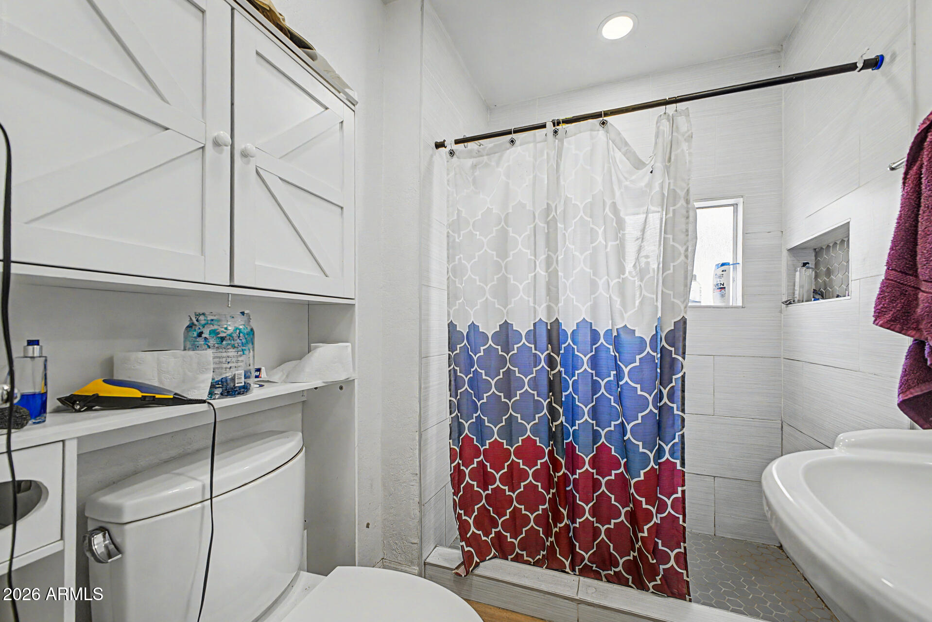 1030 North 28th Street Phoenix, AZ 85008 - Photo 17 of 24 a bathroom with a sink toilet and shower
