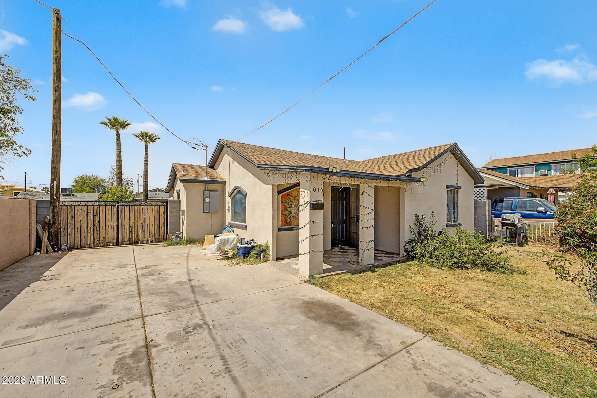 1030 North 28th Street Phoenix, AZ 85008 - Photo 2 of 24 a view of a house with wooden fence