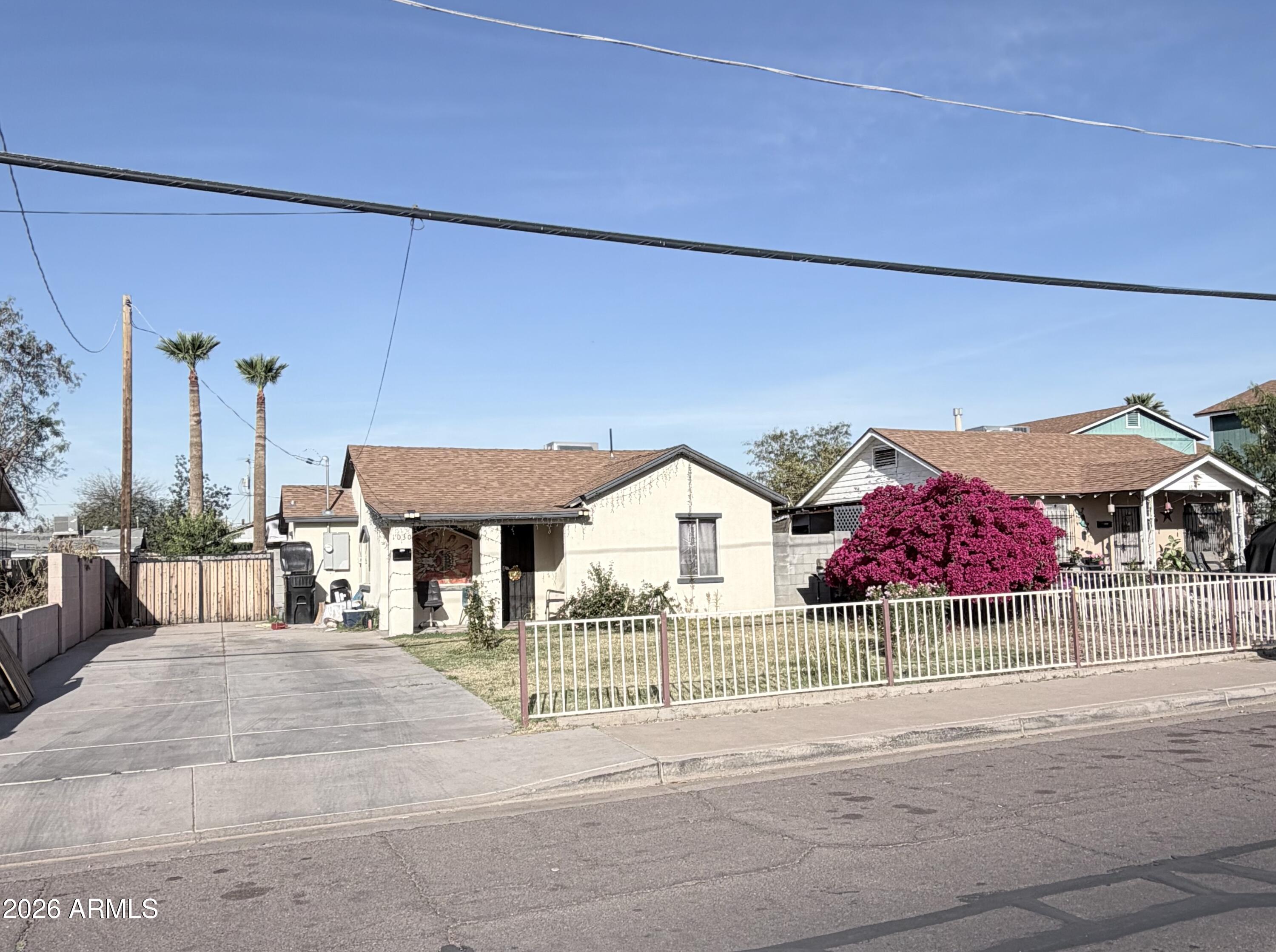 1030 North 28th Street Phoenix, AZ 85008 - Photo 23 of 24 a view of a house with a yard