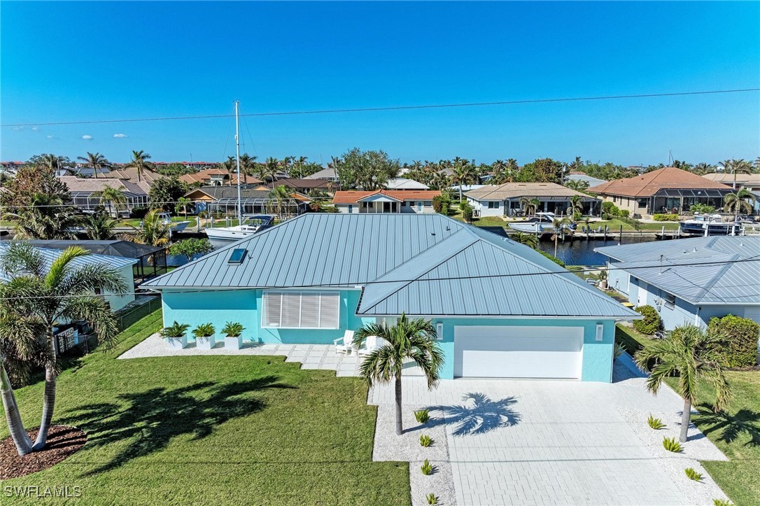 2436 Rosa Lane Punta Gorda, FL 33950 - Photo 1 of 48 a front view of a house with garden