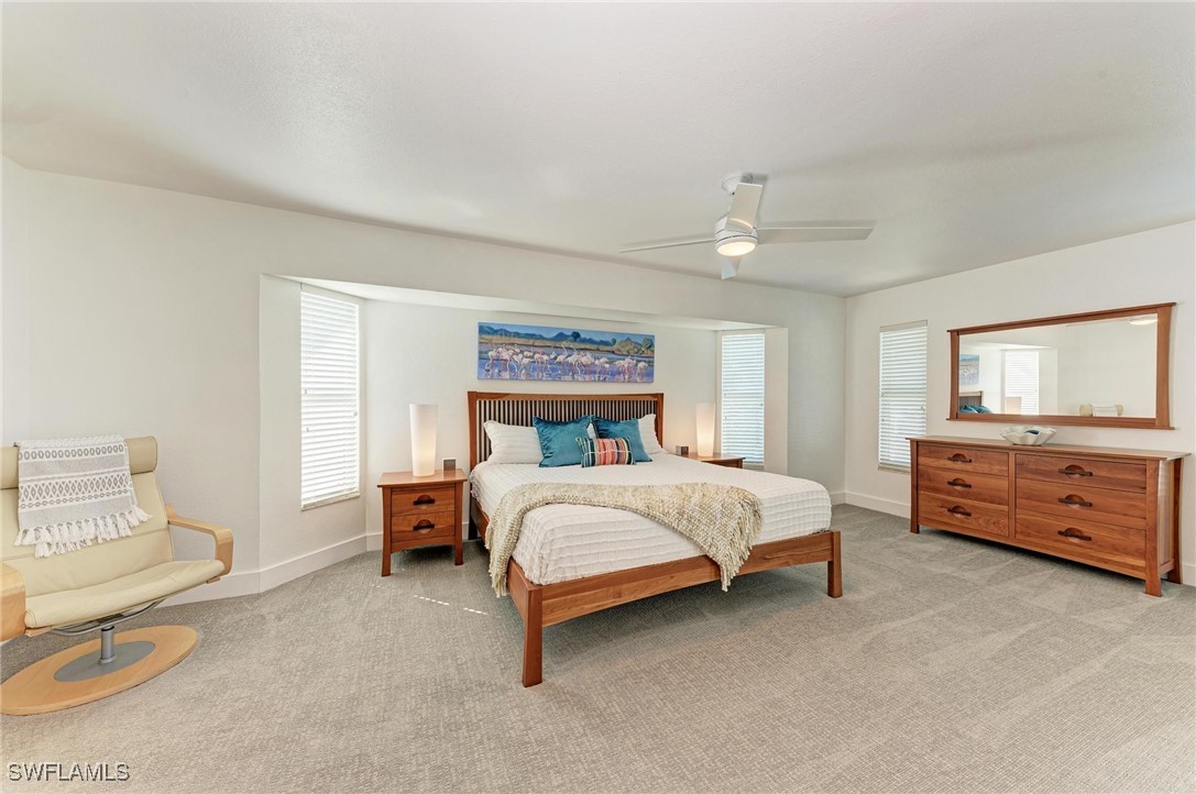 2436 Rosa Lane Punta Gorda, FL 33950 - Photo 36 of 48 a bed room with a bed and a chair