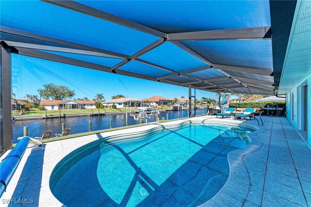 2436 Rosa Lane Punta Gorda, FL 33950 - Photo 8 of 48 a view of a swimming pool with outdoor seating