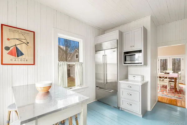 a kitchen with stainless steel appliances a refrigerator and stove