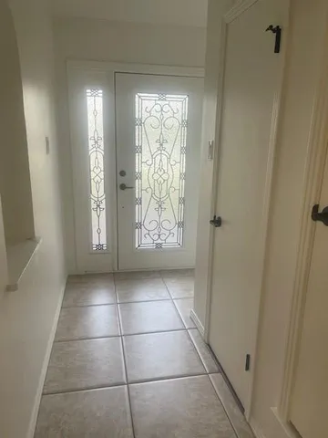 a view of an empty room and window