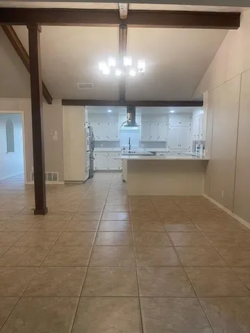 a view of a kitchen with a sink