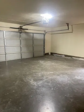 a front view of a house with a brick wall