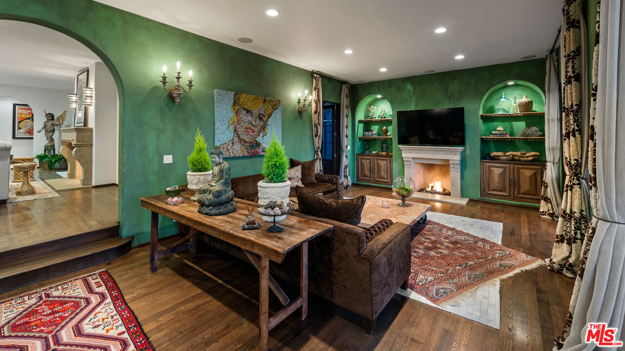 7546 Rindge Avenue Playa del Rey, CA 90293 - Photo 11 of 67 a living room with furniture a flat screen tv and a floor to ceiling window