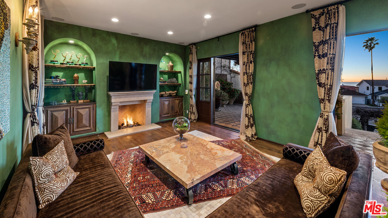 7546 Rindge Avenue Playa del Rey, CA 90293 - Photo 13 of 67 a living room with furniture a flat screen tv and a fireplace