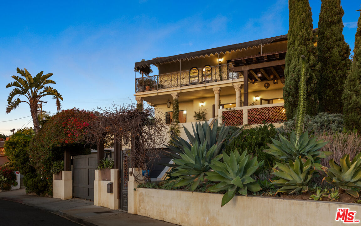 7546 Rindge Avenue Playa del Rey, CA 90293 - Photo 3 of 67 a front view of a building with palm trees