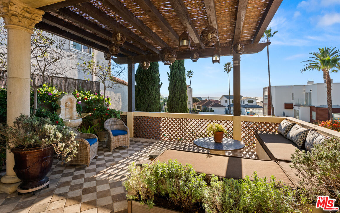 7546 Rindge Avenue Playa del Rey, CA 90293 - Photo 38 of 67 a roof deck with table and chairs potted plants