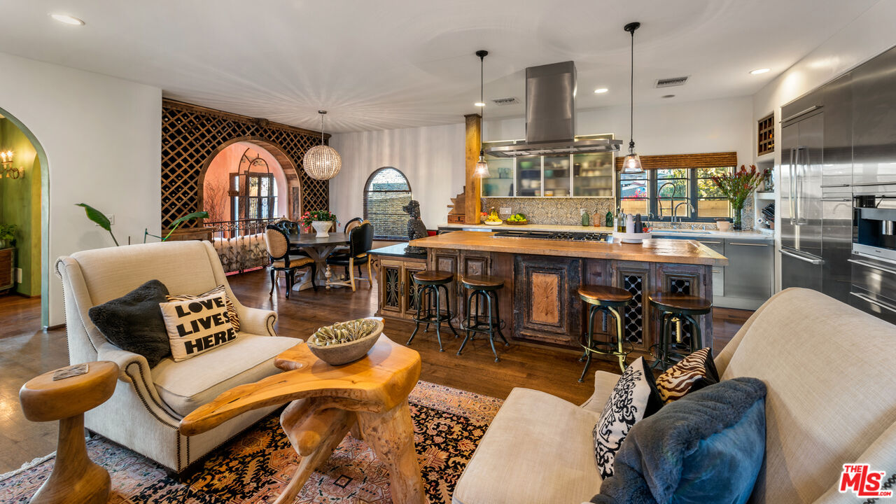 7546 Rindge Avenue Playa del Rey, CA 90293 - Photo 46 of 67 a living room with lots of furniture and a chandelier