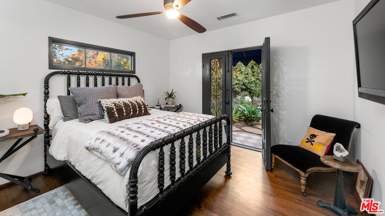 7546 Rindge Avenue Playa del Rey, CA 90293 - Photo 55 of 67 a bedroom with a bed window and a flat screen tv