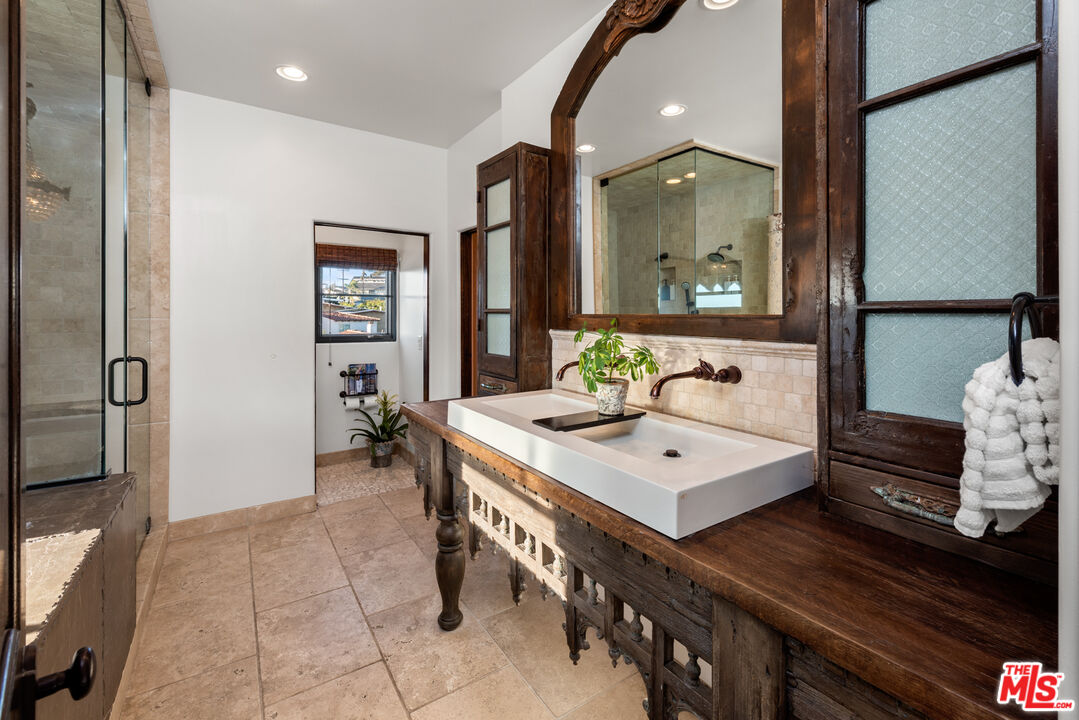 7546 Rindge Avenue Playa del Rey, CA 90293 - Photo 65 of 67 a bathroom with a sink a mirror and a shower